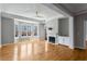 Bright living room features a fireplace, hardwood floors, and large windows at 850 Piedmont Ne Ave # 2509, Atlanta, GA 30308