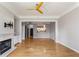 Spacious living room with fireplace, hardwood floors, and open layout to kitchen at 850 Piedmont Ne Ave # 2509, Atlanta, GA 30308