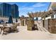 Outdoor patio with dining tables, lounge seating, a pergola, and high-rise buildings at 850 Piedmont Ne Ave # 2509, Atlanta, GA 30308