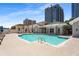 Relaxing community pool with ladder access and lounge chairs, offering a refreshing escape in the city at 850 Piedmont Ne Ave # 2509, Atlanta, GA 30308
