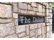 Stone wall with the name of the building community, The Dakota at 850 Piedmont Ne Ave # 2509, Atlanta, GA 30308