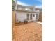 Backyard featuring brick patio, fenced yard, and access to the house at 1098 Eastview Ne Cir, Conyers, GA 30012
