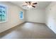 Clean, empty bedroom with plush carpeting, natural light, and neutral walls at 1098 Eastview Ne Cir, Conyers, GA 30012