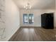 Dining room with hardwood floors and doors leading to outdoor area at 1098 Eastview Ne Cir, Conyers, GA 30012