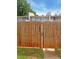 Wooden backyard gate with the address number '1028' displayed on the gate at 1098 Eastview Ne Cir, Conyers, GA 30012