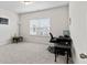 A bright bedroom featuring gray carpet, neutral walls, and a large window at 305 Knights Ct, Canton, GA 30115