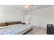 Bright bedroom with a bed, neutral decor, and an ensuite bathroom at 305 Knights Ct, Canton, GA 30115