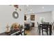 Open dining room with view of kitchen featuring stainless steel appliances and a granite countertop island at 305 Knights Ct, Canton, GA 30115