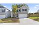 Charming two-story home featuring a two-car garage and a beautifully landscaped front yard at 305 Knights Ct, Canton, GA 30115