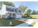 Beautiful two-story home features a two-car garage, landscaped front yard, and a welcoming entrance at 305 Knights Ct, Canton, GA 30115