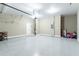 Clean garage space featuring an epoxy floor and an automatic door at 305 Knights Ct, Canton, GA 30115