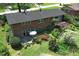 Brick home with a spacious backyard, patio with umbrella table, and mature trees at 4360 Pleasant Forest Dr, Decatur, GA 30034