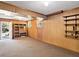 Finished basement featuring carpet floors, wood paneling, and built-in shelves at 4360 Pleasant Forest Dr, Decatur, GA 30034