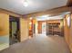 Finished basement with wood paneling, carpet floors and built-in shelves at 4360 Pleasant Forest Dr, Decatur, GA 30034
