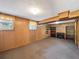 Cozy finished basement with wood paneling, carpet, and built-in shelving, creating a warm and inviting space at 4360 Pleasant Forest Dr, Decatur, GA 30034