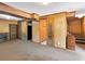 Finished basement with wood paneling, carpet, built-in shelving and cabinets and access to upper floor at 4360 Pleasant Forest Dr, Decatur, GA 30034