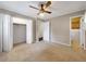Spacious bedroom with a ceiling fan, carpeted floors, and a closet and bathroom entrance at 4360 Pleasant Forest Dr, Decatur, GA 30034