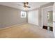 Bedroom featuring a neutral color scheme, carpet flooring, a closet, and natural light from a window at 4360 Pleasant Forest Dr, Decatur, GA 30034