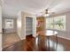 Dining room with hardwood floors, ceiling fan, windows, closet, and view to kitchen at 4360 Pleasant Forest Dr, Decatur, GA 30034