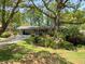 Ranch home with covered parking, large front yard, and beautiful landscaping at 4360 Pleasant Forest Dr, Decatur, GA 30034