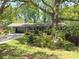 Ranch home with covered parking, large front yard, and beautiful landscaping at 4360 Pleasant Forest Dr, Decatur, GA 30034