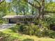 Ranch home with covered parking, large front yard, and beautiful landscaping at 4360 Pleasant Forest Dr, Decatur, GA 30034