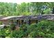 Charming single-story brick home featuring a welcoming front porch and professionally landscaped front yard at 4360 Pleasant Forest Dr, Decatur, GA 30034
