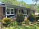 Charming brick home features a cozy front porch and meticulously landscaped yard at 4360 Pleasant Forest Dr, Decatur, GA 30034