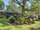 Traditional home with well-maintained lawn, mature trees, and tidy landscaping at 4360 Pleasant Forest Dr, Decatur, GA 30034