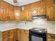 Kitchen with wood cabinets and light countertops at 4360 Pleasant Forest Dr, Decatur, GA 30034