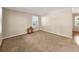 Spacious living room offers neutral walls, carpet floors, and a small side table at 4360 Pleasant Forest Dr, Decatur, GA 30034