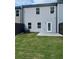 Well-maintained backyard with a green lawn, patio and privacy fence at 6424 Rosetta Dr, South Fulton, GA 30331