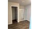 Bathroom showcasing a glass-enclosed shower and wood-look floors at 6424 Rosetta Dr, South Fulton, GA 30331