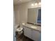 Bathroom with a stylish vanity with granite countertop and a bathtub shower combination at 6424 Rosetta Dr, South Fulton, GA 30331
