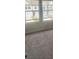 Bedroom featuring neutral carpet and two windows for natural light at 6424 Rosetta Dr, South Fulton, GA 30331