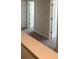 Upstairs hallway featuring carpet and doors to various rooms at 6424 Rosetta Dr, South Fulton, GA 30331
