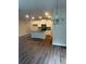Open-concept kitchen features a large island, granite countertops, and white cabinets at 6424 Rosetta Dr, South Fulton, GA 30331