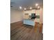 Open-concept kitchen features a large island, granite countertops, and white cabinets at 6424 Rosetta Dr, South Fulton, GA 30331