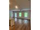 Open-concept living area with hardwood floors, recessed lighting, and lots of natural light at 6424 Rosetta Dr, South Fulton, GA 30331