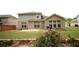Brick house backyard with landscaping, greenery, and patio at 1142 Terrasol Rdg, Lilburn, GA 30047