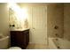 Bright bathroom with shower-tub combination and neutral tiling, providing a clean aesthetic at 1142 Terrasol Rdg, Lilburn, GA 30047