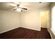 Bedroom featuring ceiling fan and hardwood floors complemented by natural light at 1142 Terrasol Rdg, Lilburn, GA 30047