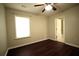 Well-lit bedroom with wood-look floors and an en suite bathroom at 1142 Terrasol Rdg, Lilburn, GA 30047