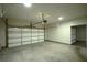 Spacious garage featuring a large door and ample room for vehicles and storage at 1142 Terrasol Rdg, Lilburn, GA 30047