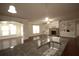 Open-concept kitchen featuring a large island with a stainless steel sink and dark wood floors throughout at 1142 Terrasol Rdg, Lilburn, GA 30047