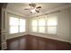 Sunlit living room with a ceiling fan and multiple windows offering great light at 1142 Terrasol Rdg, Lilburn, GA 30047