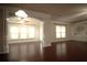 Bright and airy living room featuring dark hardwood floors and natural light at 1142 Terrasol Rdg, Lilburn, GA 30047