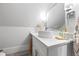 Clean, minimalist bathroom with a vessel sink, quartz countertop, and modern lighting fixtures at 1188 Woodtrace Ln, Auburn, GA 30011