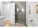 Modern bathroom with a glass shower and neutral gray tile at 1188 Woodtrace Ln, Auburn, GA 30011