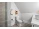 Neutral toned bathroom featuring a glass enclosed shower, decorative tile, and a modern toilet at 1188 Woodtrace Ln, Auburn, GA 30011